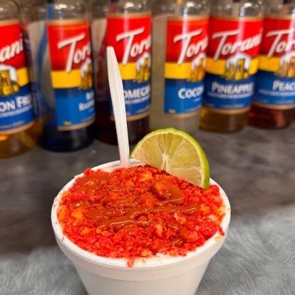 Esquites topped with crushed Flamin' Hot Cheetos