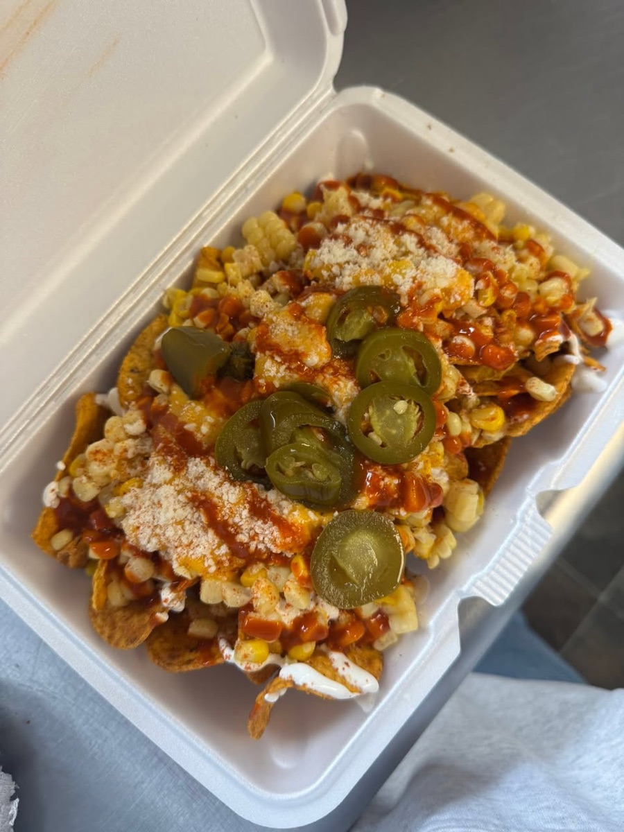 Nachos loaded with esquites, jalapeños and cotija