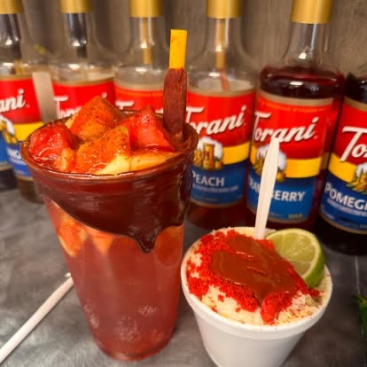 A mangonada and a cup of esquites side by side